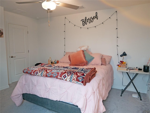 carpeted bedroom with ceiling fan