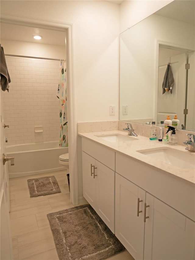 full bathroom featuring tile patterned flooring, vanity, shower / bath combination with curtain, and toilet