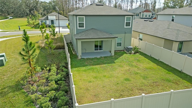 back of house with a yard, central AC, and a patio area