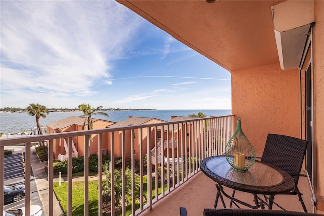 balcony featuring a water view