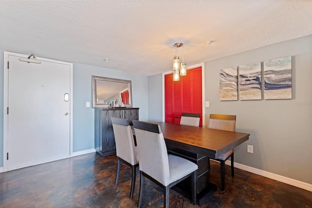 dining space with a textured ceiling