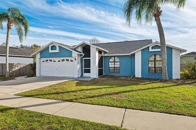 single story home with a garage and a front yard