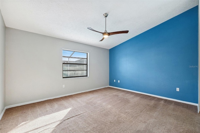 spare room with carpet flooring, a textured ceiling, and ceiling fan