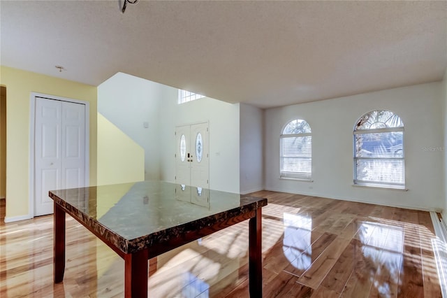 unfurnished dining area featuring light hardwood / wood-style flooring