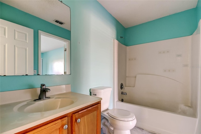 full bathroom with shower / washtub combination, vanity, and toilet