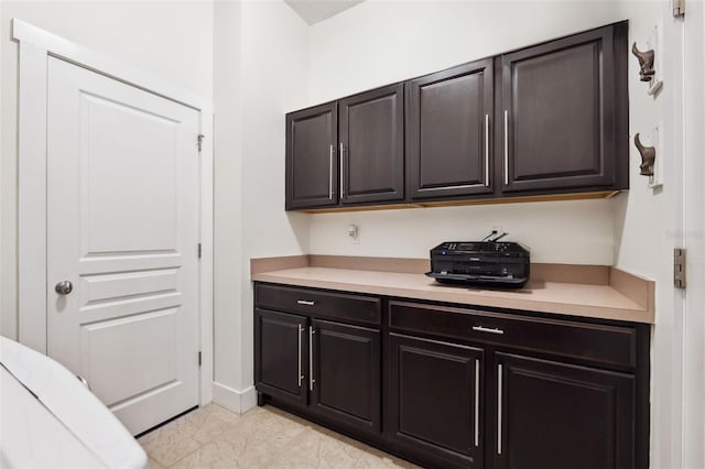 bar featuring dark brown cabinetry