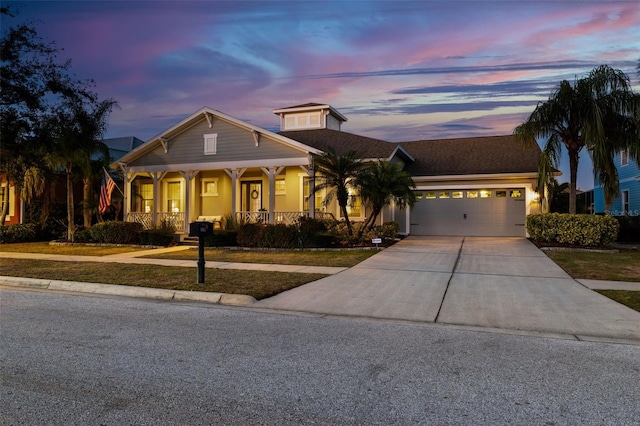 view of front facade featuring a garage and covered porch