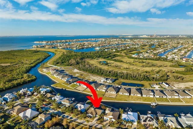 birds eye view of property featuring a residential view and a water view