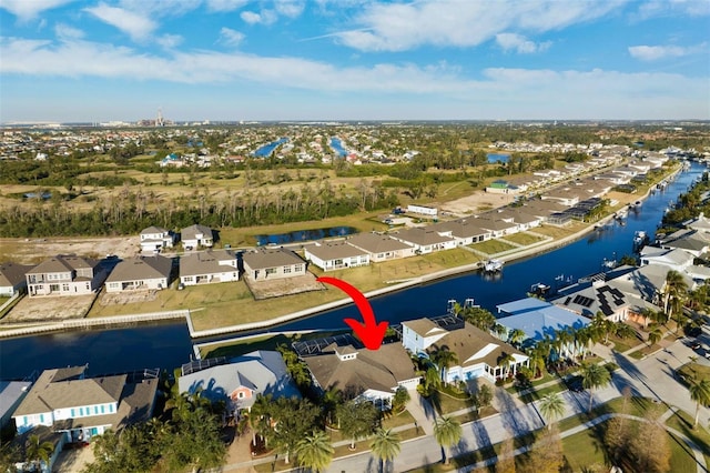 birds eye view of property featuring a residential view and a water view