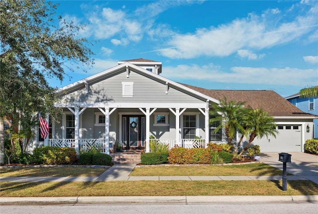 view of front of house featuring a garage and covered porch