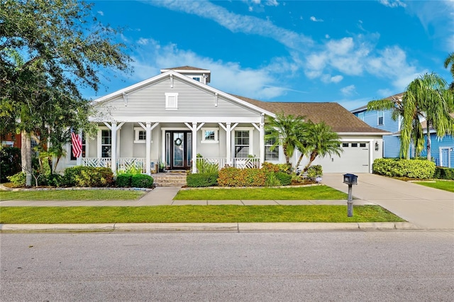 view of front of home featuring a porch, an attached garage, a shingled roof, stucco siding, and concrete driveway