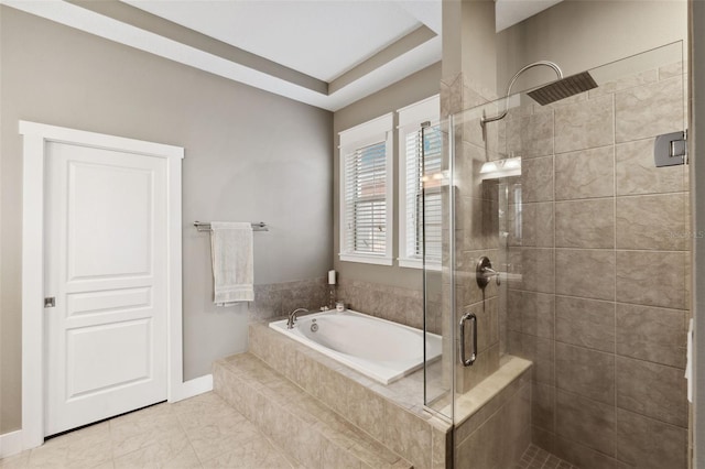 bathroom with a garden tub and a stall shower