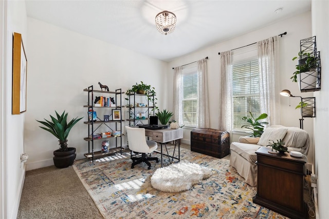 home office featuring baseboards and carpet floors