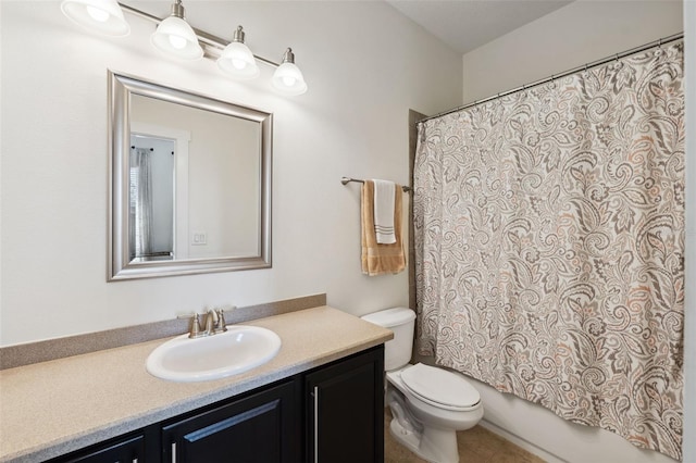 full bath featuring toilet, shower / tub combo with curtain, vanity, and tile patterned flooring