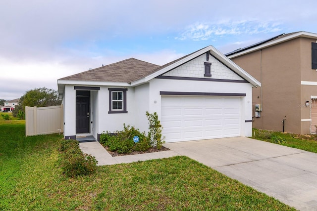 ranch-style house with a front lawn and a garage