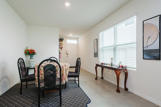 dining space featuring light tile patterned floors