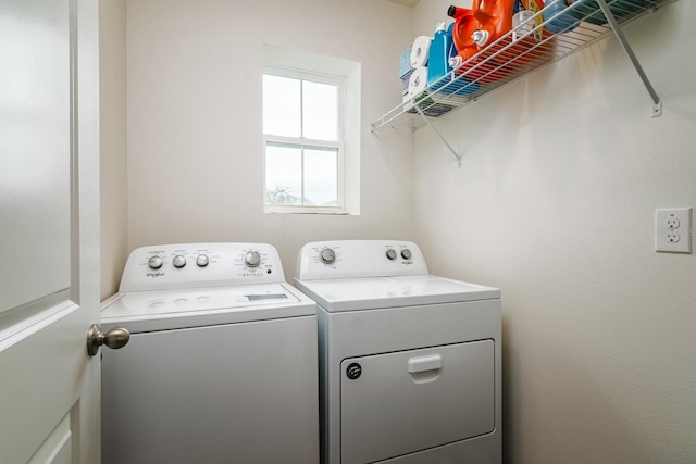 laundry room featuring washing machine and dryer