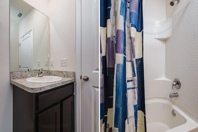 bathroom featuring vanity and shower / bath combo with shower curtain