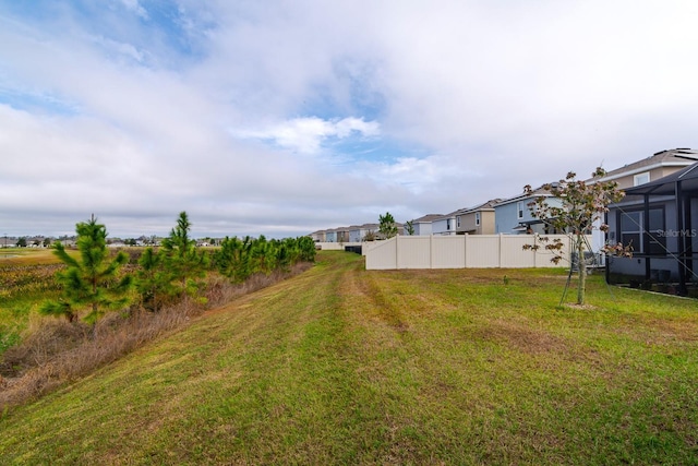 view of yard featuring a lanai