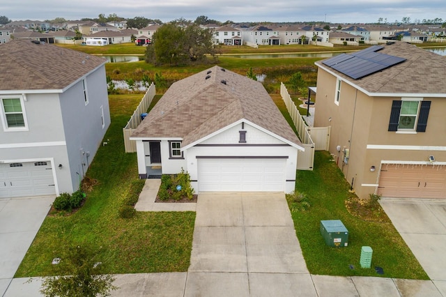 birds eye view of property with a water view