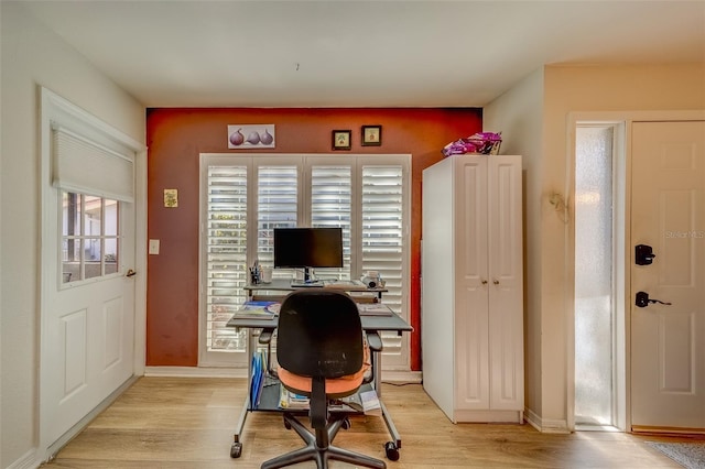 office with light hardwood / wood-style floors