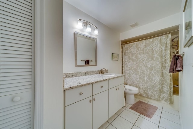 full bathroom with tile patterned flooring, shower / bath combo, vanity, and toilet