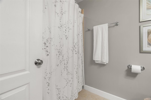 bathroom with tile patterned floors