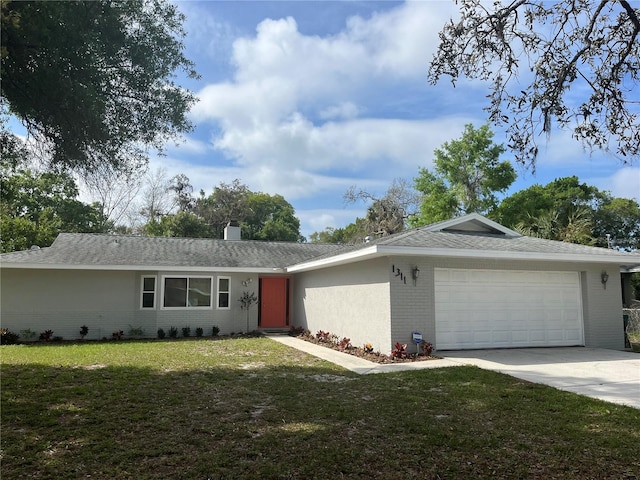 ranch-style house with a garage and a front yard