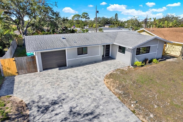 single story home with a garage