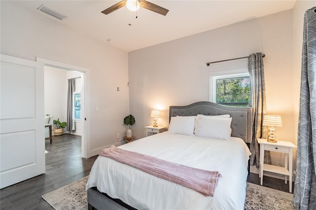 bedroom featuring ceiling fan and dark hardwood / wood-style floors