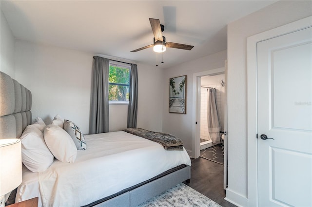 bedroom featuring ensuite bath, ceiling fan, and dark hardwood / wood-style floors