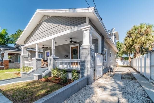 bungalow-style house featuring ceiling fan and a porch