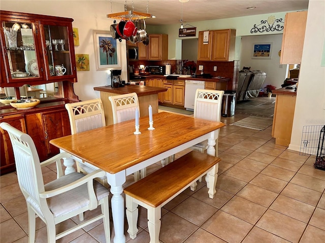 dining area with light tile patterned flooring