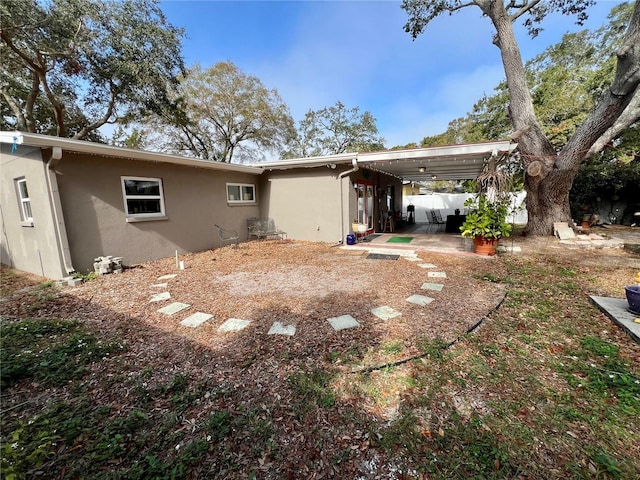 rear view of house with a patio area