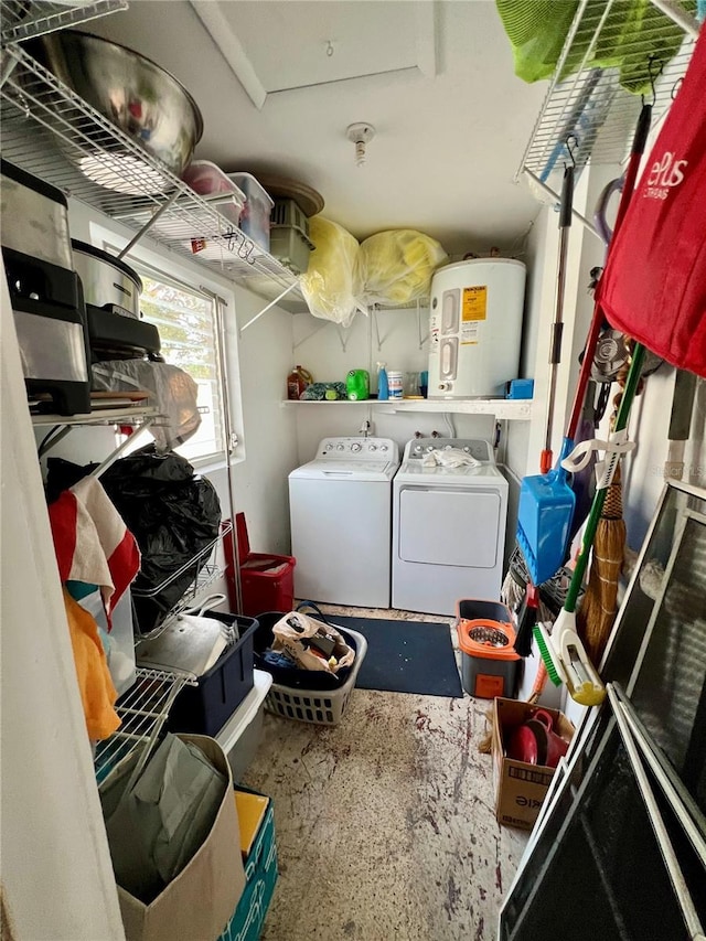 laundry room with washer and clothes dryer and electric water heater