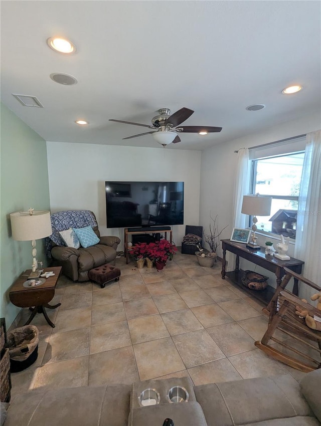 living room featuring ceiling fan and light tile patterned floors