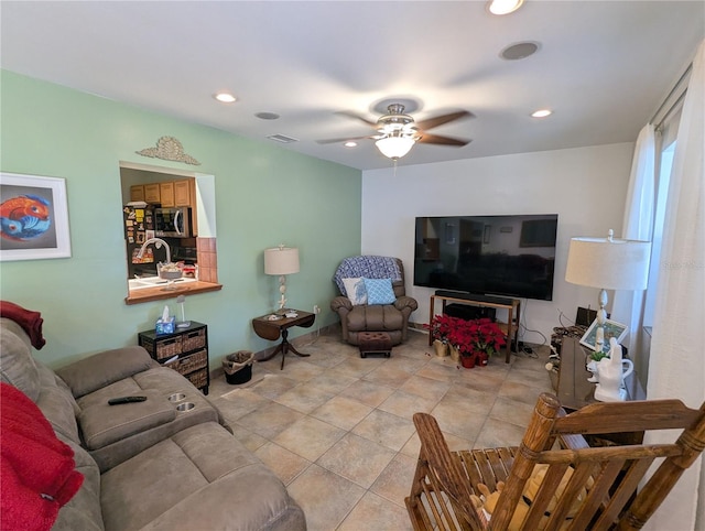 tiled living room featuring ceiling fan