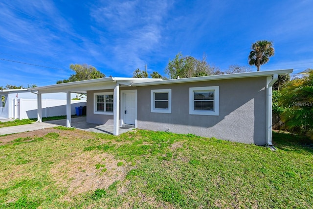 exterior space featuring a patio and a front lawn