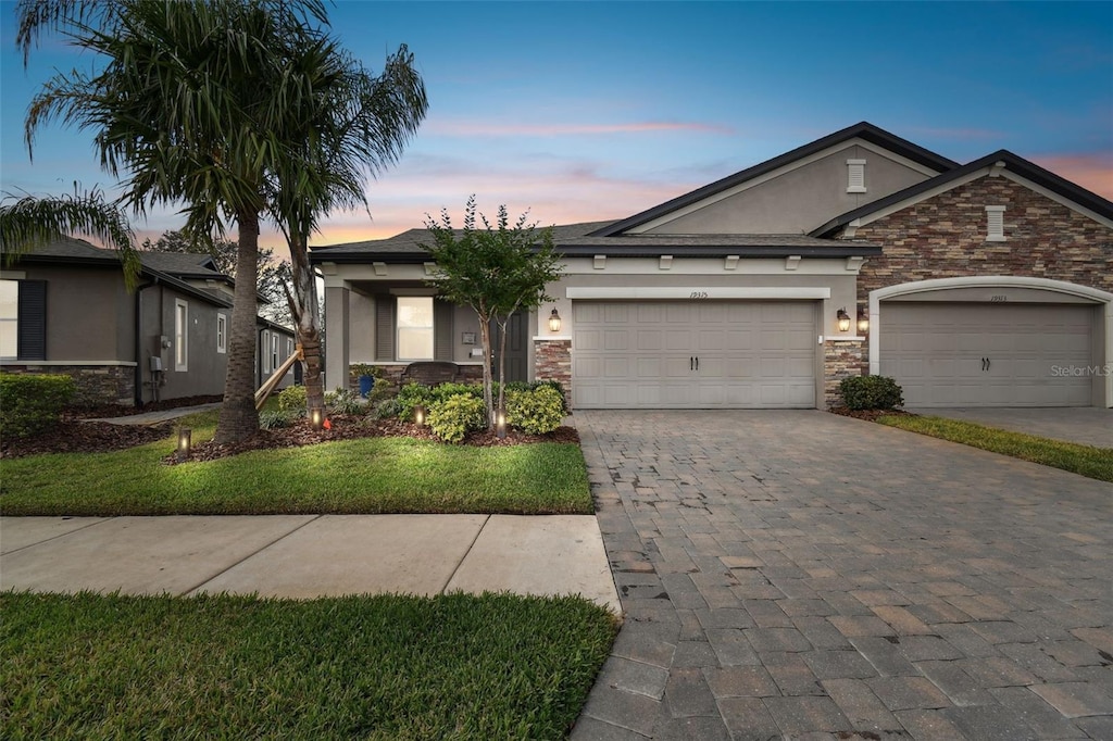 ranch-style house featuring a garage