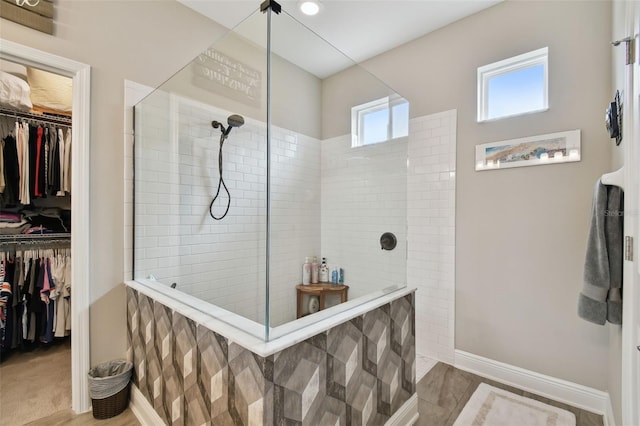 19315 Hawk Valley Dr, Tampa, FL 33647 - bathroom featuring hardwood / wood-style floors and a tile shower