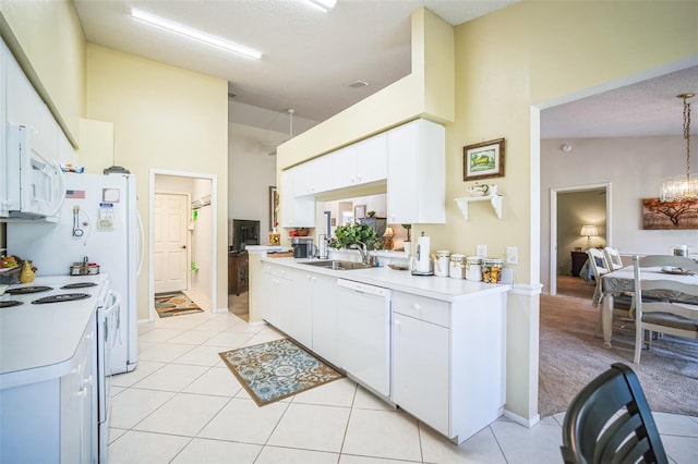 kitchen with white cabinets, pendant lighting, white appliances, and sink