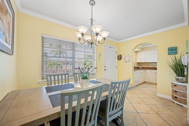 tiled dining space with a chandelier and ornamental molding