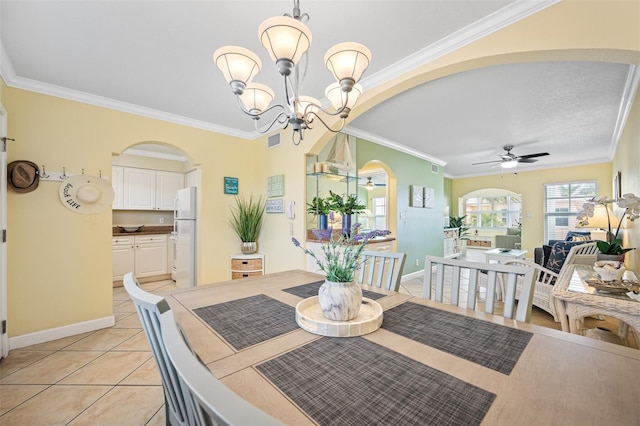 dining area featuring light tile patterned flooring, ceiling fan with notable chandelier, and ornamental molding