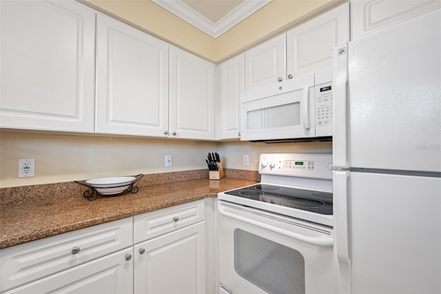 kitchen with crown molding, white cabinets, dark stone counters, and white appliances