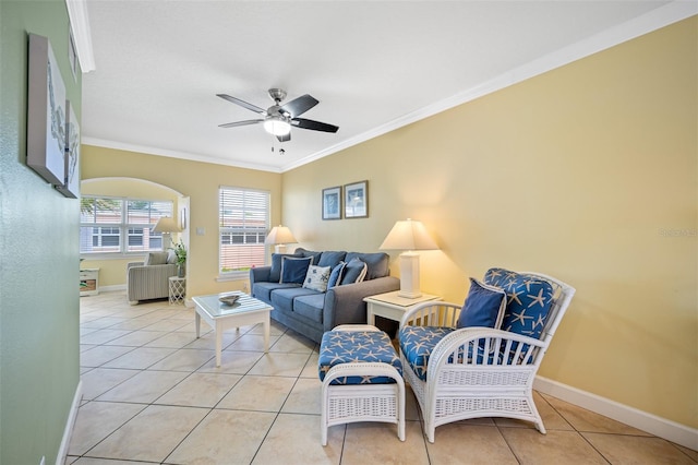 tiled living room with ceiling fan and ornamental molding