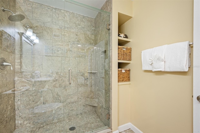 bathroom with a shower with shower door