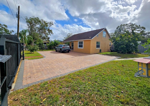 view of home's exterior with a yard