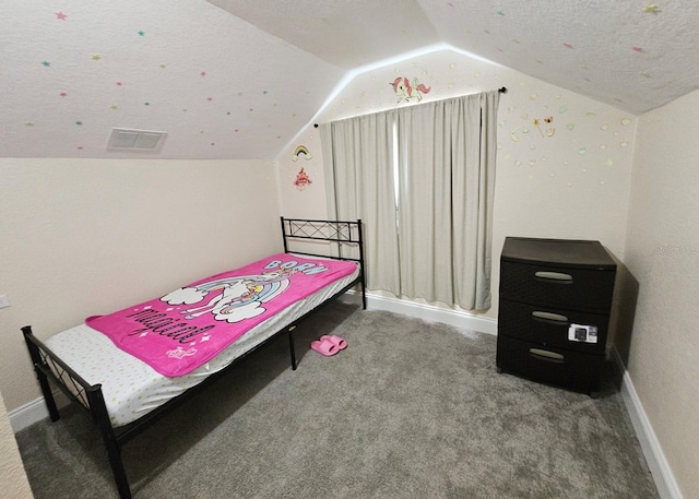 carpeted bedroom featuring lofted ceiling and a textured ceiling