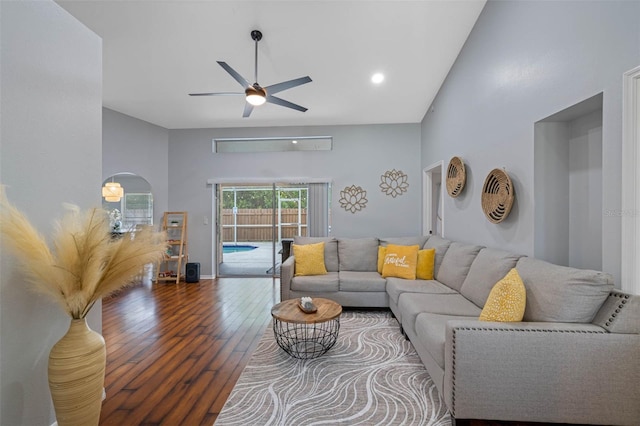 living room featuring wood-type flooring and ceiling fan