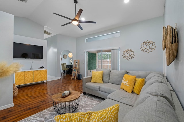 living room featuring ceiling fan, wood-type flooring, and vaulted ceiling